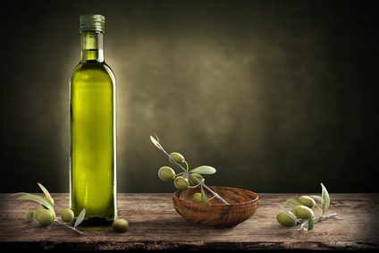 Bottle of oil with olive branch